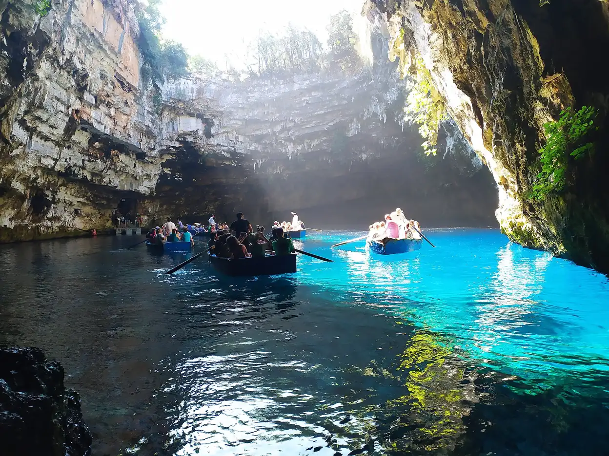 Tour boat on the blue lake inside Melissani Cave, Kefalonia, Greece