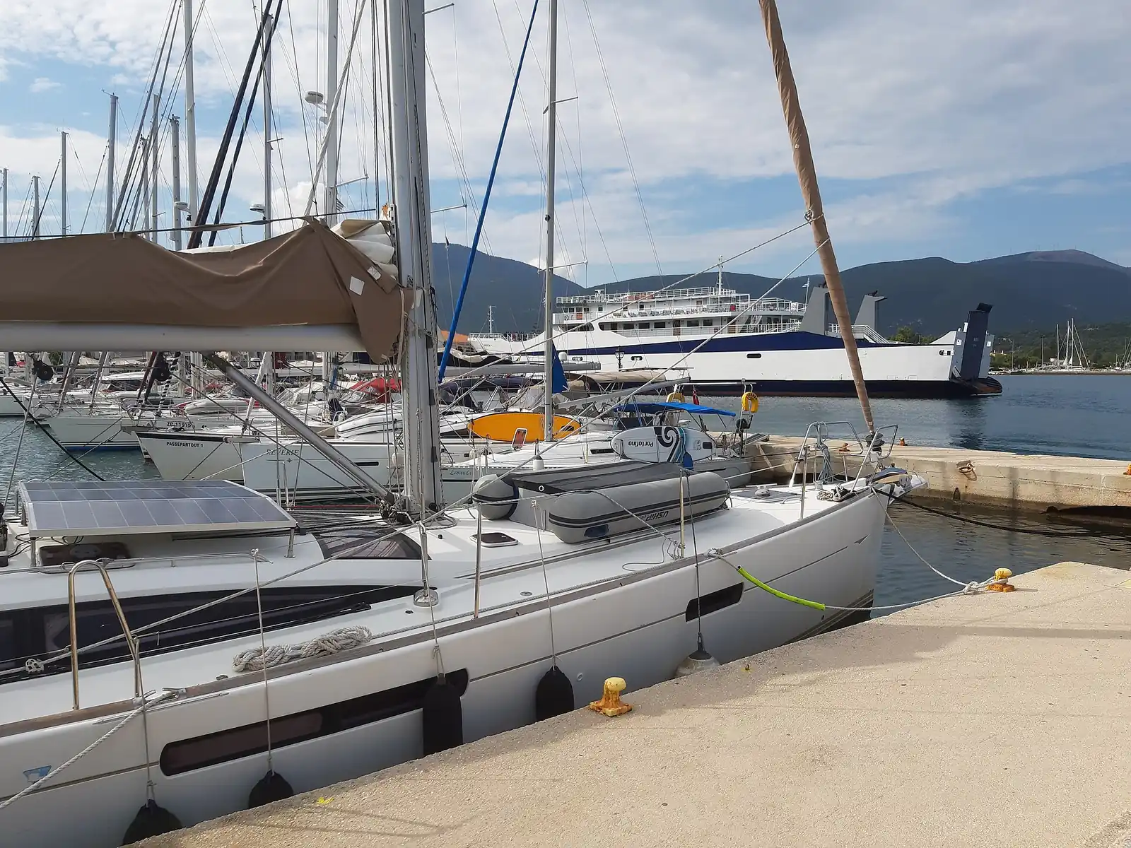 Sailboats and a ferry moored in the harbour at Sami, Kefalonia