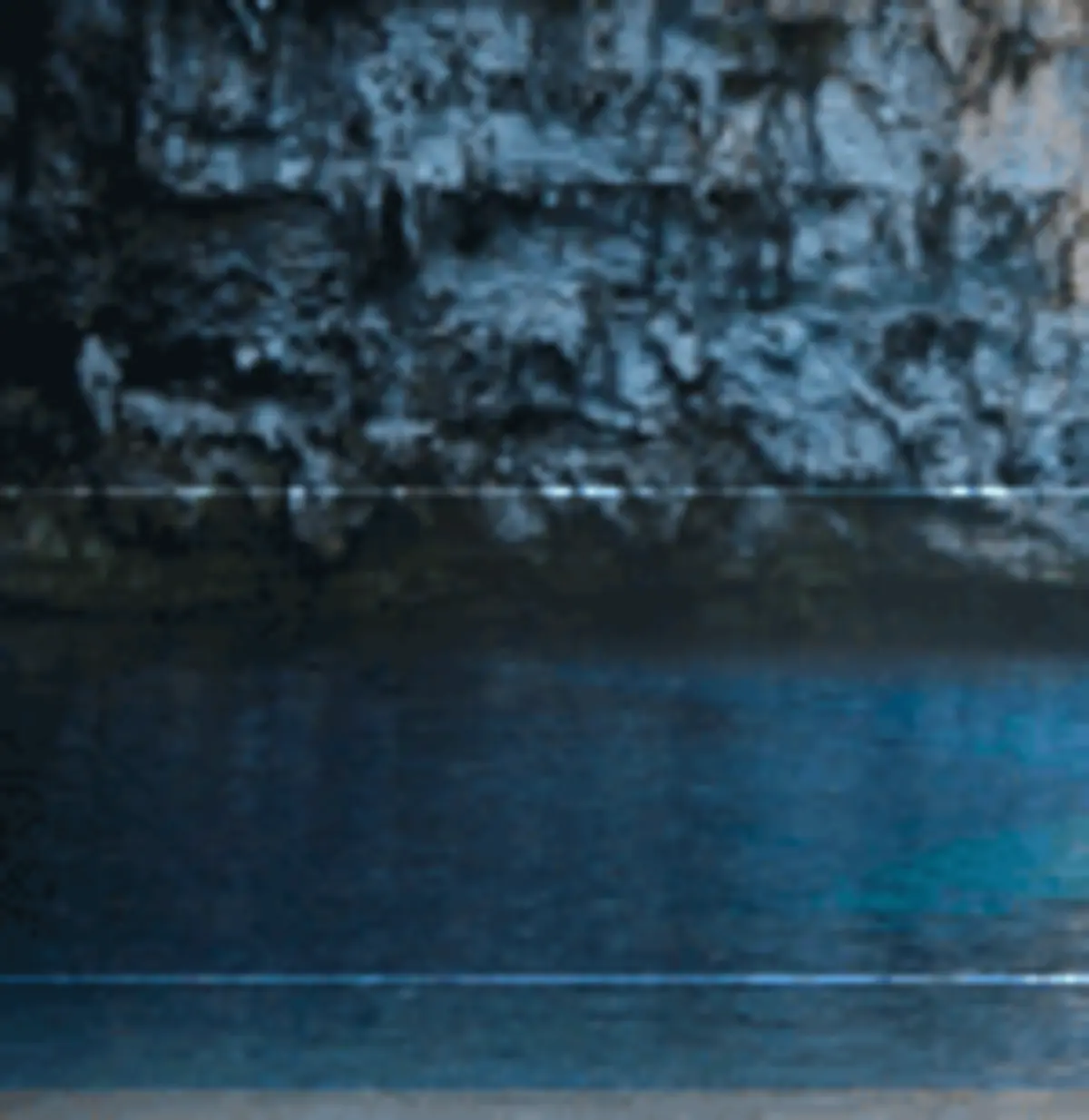 Melissani Cave underground lake in winter with soft light filtering through the collapsed roof