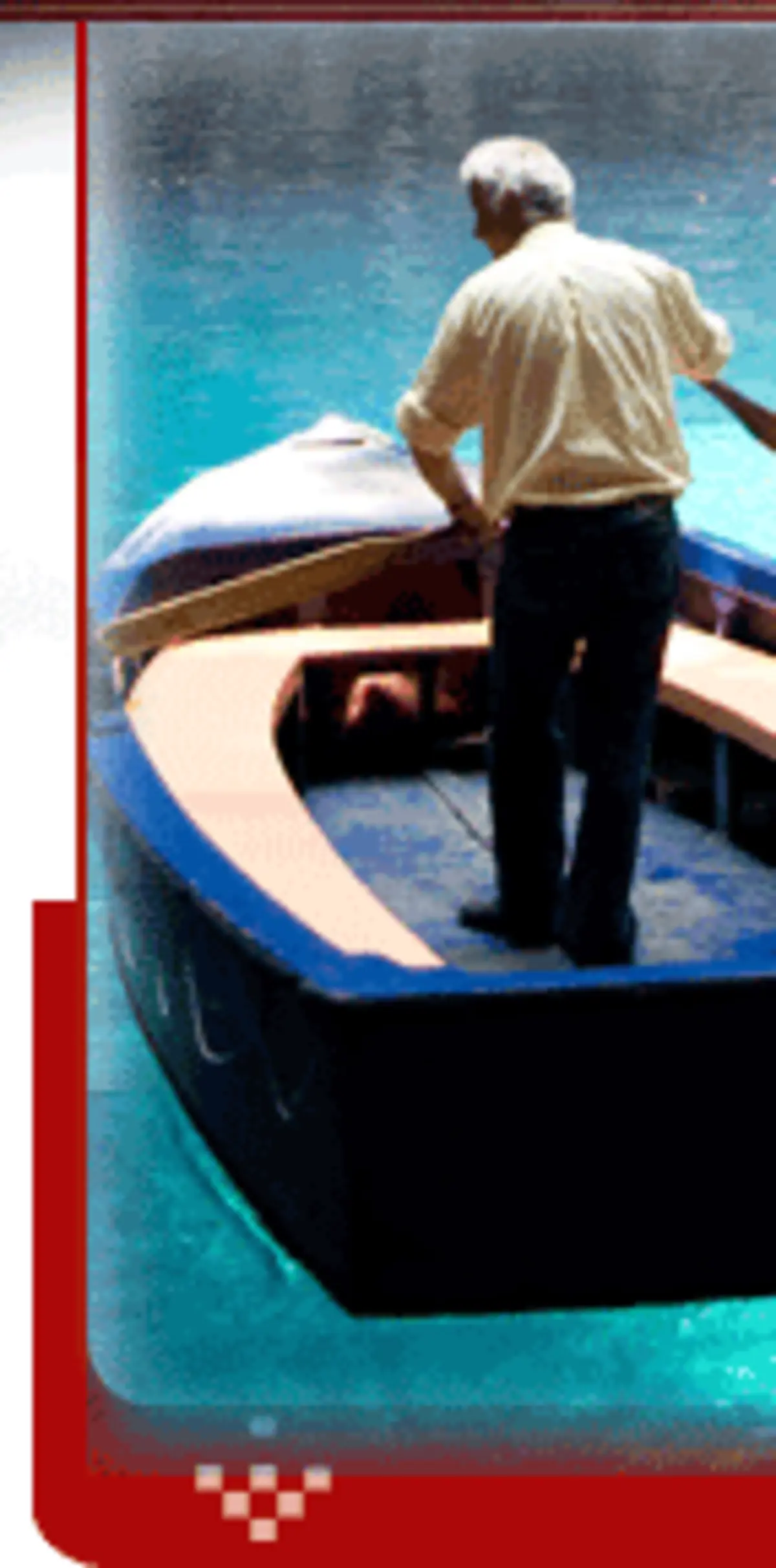 Visitor in a wooden boat on the turquoise underground lake of Melissani Cave