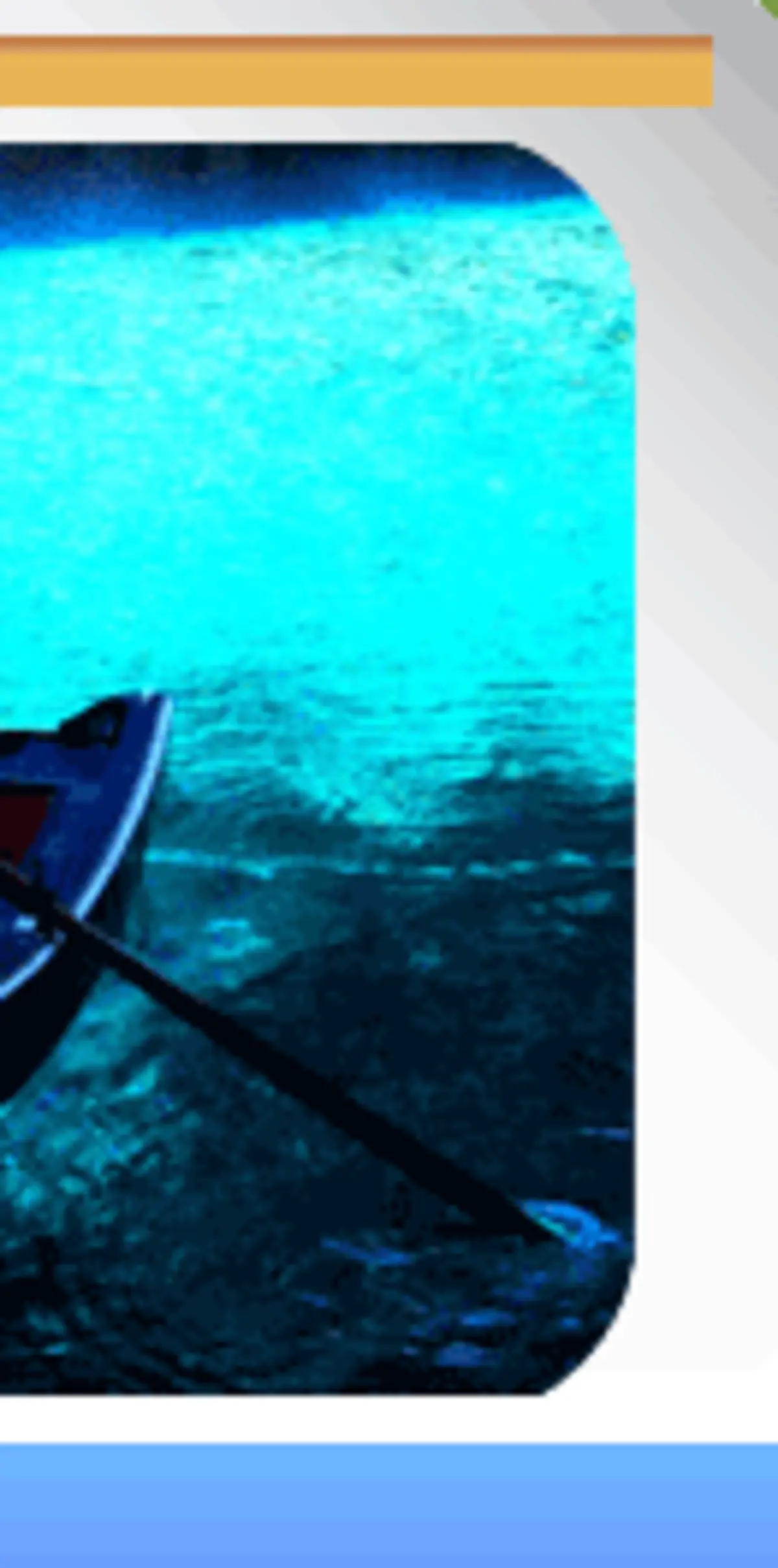 Rowboat on turquoise underground lake inside Melissani Cave, illuminated by natural skylight